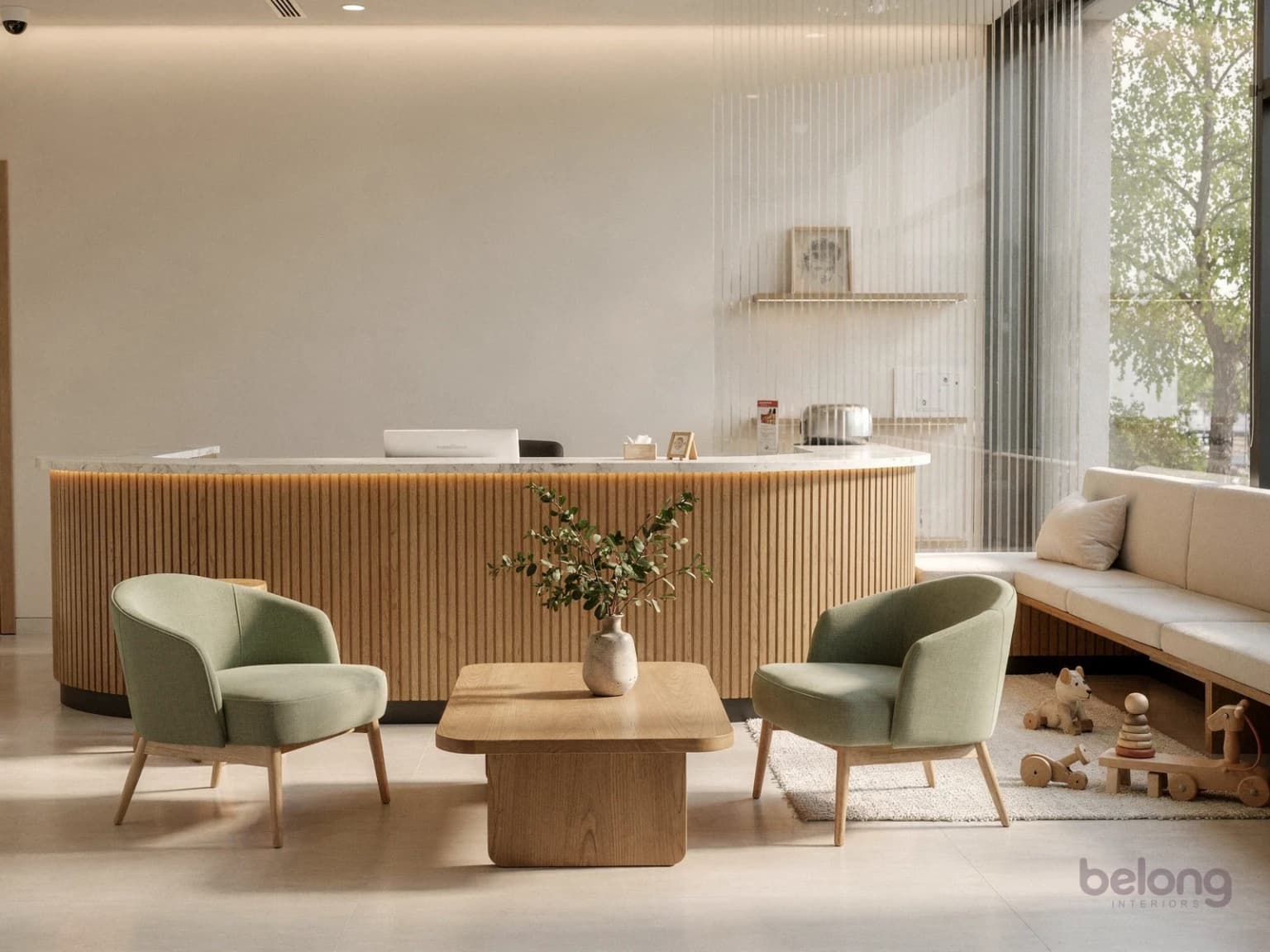 Clinic reception with a fluted oak desk and sage armchairs in a calm waiting area