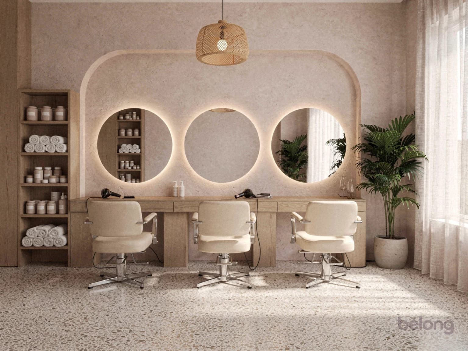 Salon with round backlit mirrors, cream styling chairs and a terrazzo floor